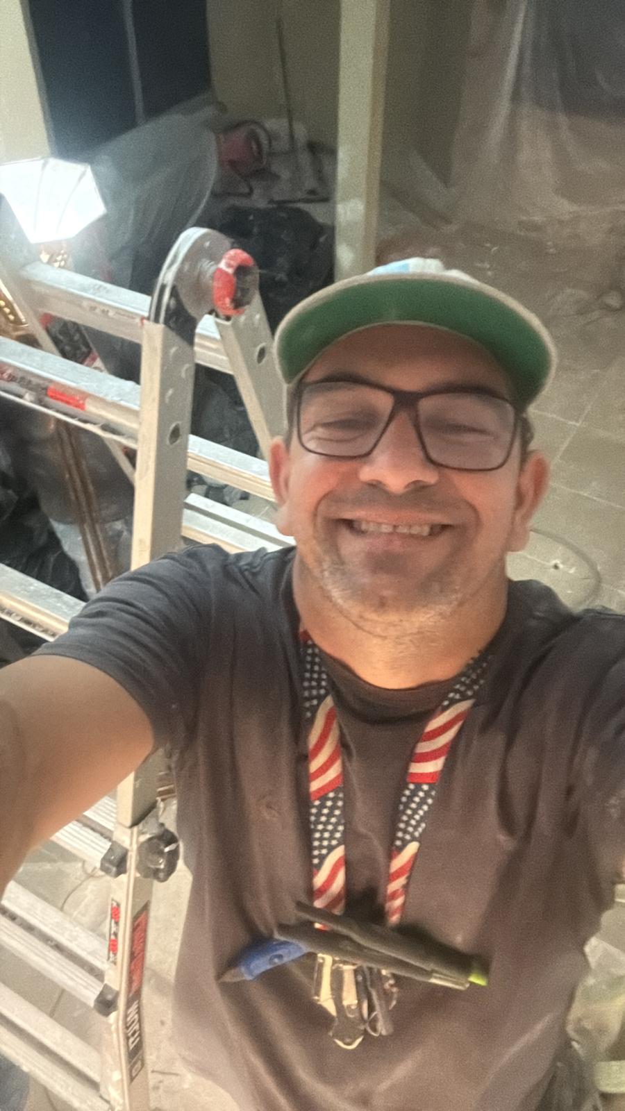 Patrick, owner of EVO Boca Raton Painters, on an interior painting project