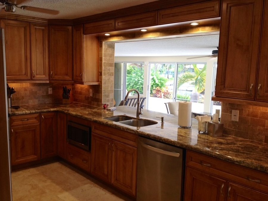 Wood cabinet kitchen with granite counters and new sink installation by Fontana Plumbing